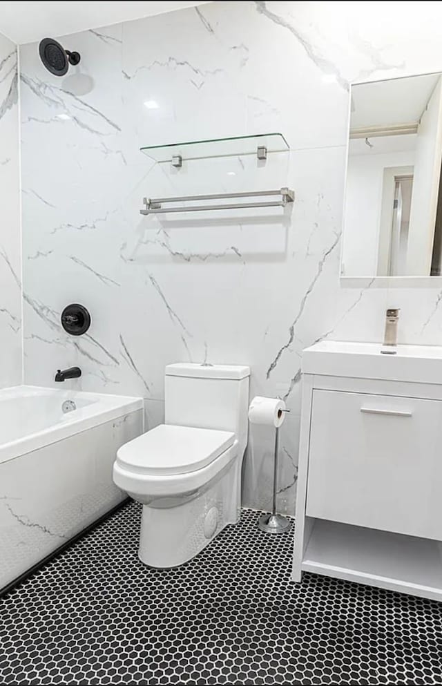 full bathroom with shower / bath combination, toilet, vanity, and tile walls