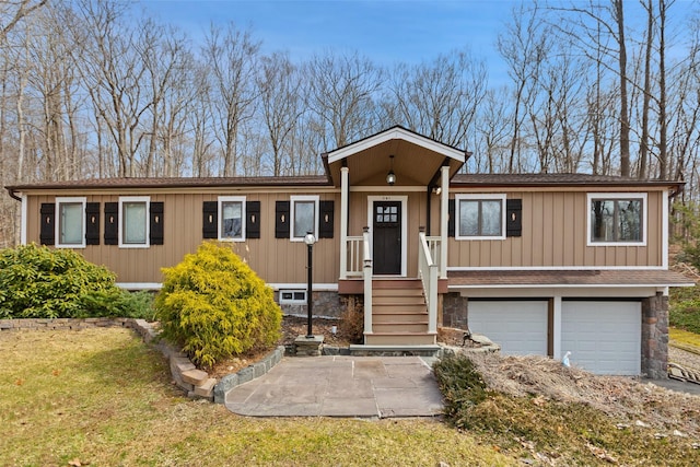 view of front facade with board and batten siding, a garage, and stone siding