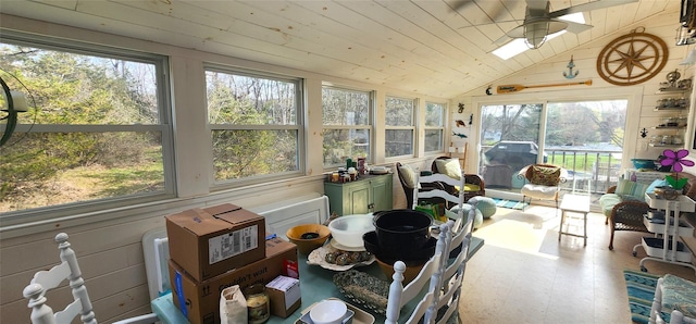 sunroom featuring lofted ceiling, tile patterned floors, and wooden ceiling