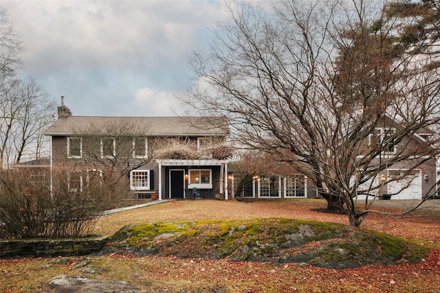 back of property featuring a chimney