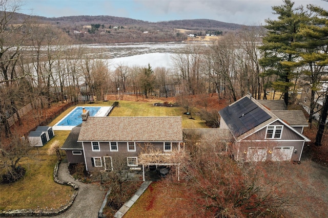 birds eye view of property featuring a mountain view