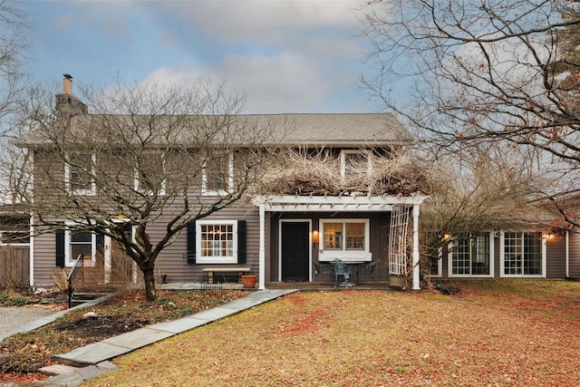 26 Curry Ln, Hyde Park, NY 12538 - view of front of house featuring a chimney and a front yard