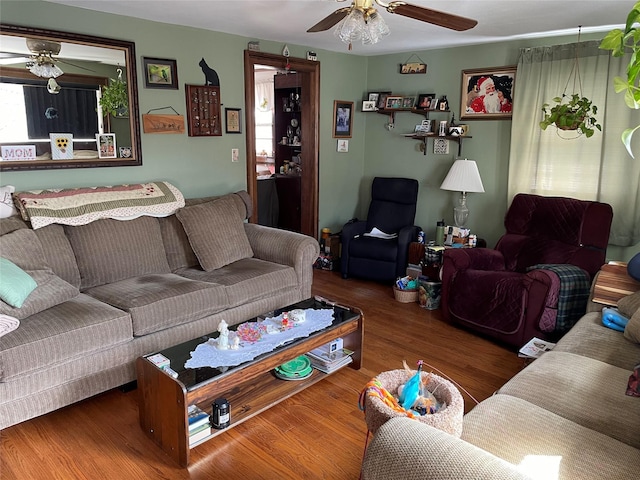 living area featuring wood finished floors and ceiling fan