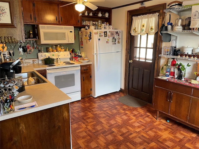 kitchen featuring a sink, open shelves, white appliances, and light countertops