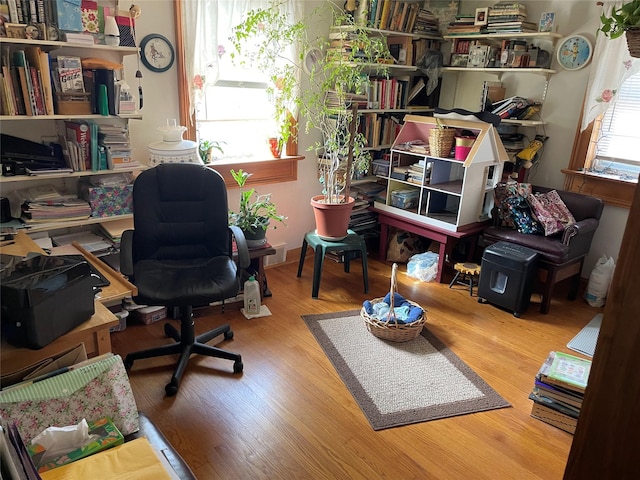 office space with wood finished floors