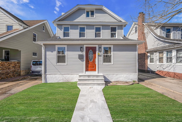 view of front of home featuring a front lawn