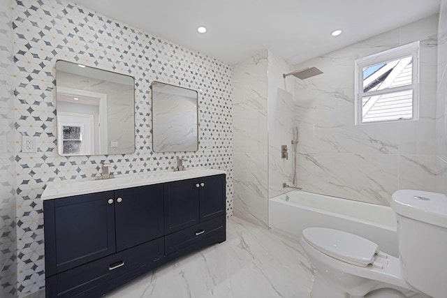 bathroom with toilet, marble finish floor, a sink, double vanity, and shower / bathtub combination