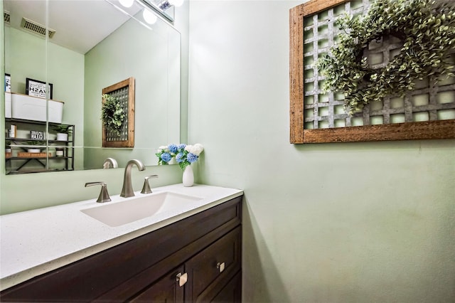 bathroom featuring visible vents and vanity