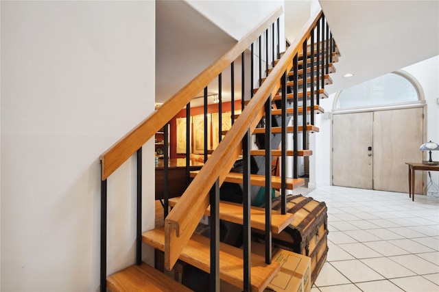 staircase with tile patterned flooring