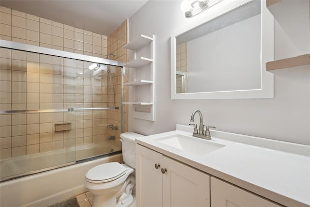 bathroom with shower / bath combination with glass door, toilet, and vanity