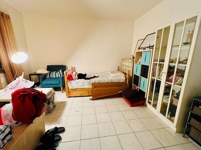 bedroom with light tile patterned floors