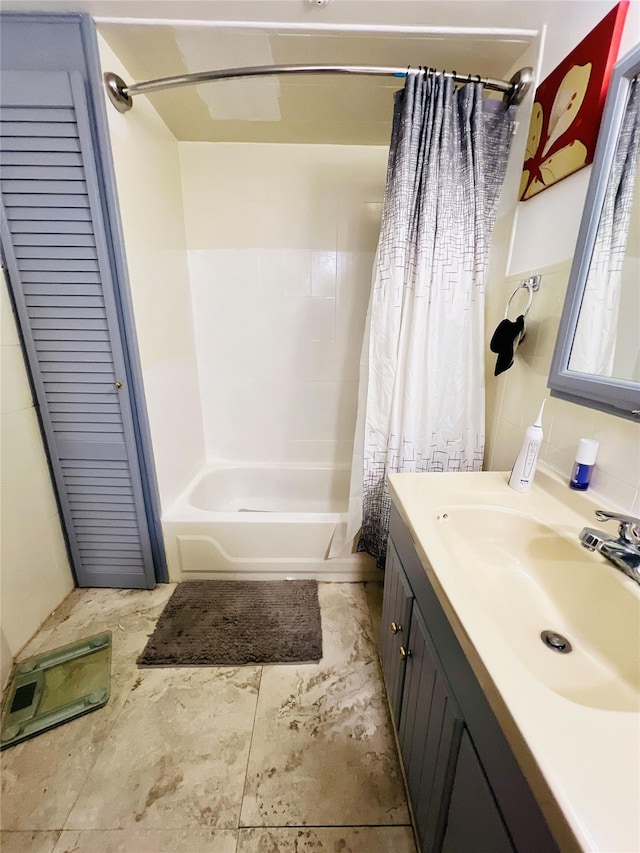 full bathroom featuring vanity and shower / tub combo