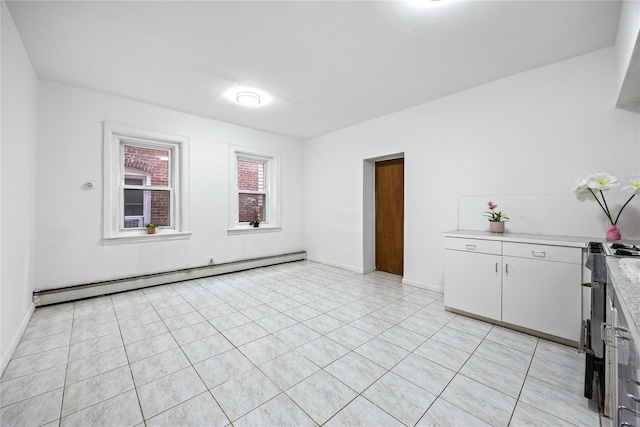 112-21 15th Ave, College Point, NY 11356 - unfurnished room with baseboard heating, light tile patterned flooring, and baseboards