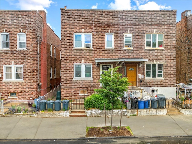 112-21 15th Ave, College Point, NY 11356 - view of front of property with brick siding and cooling unit