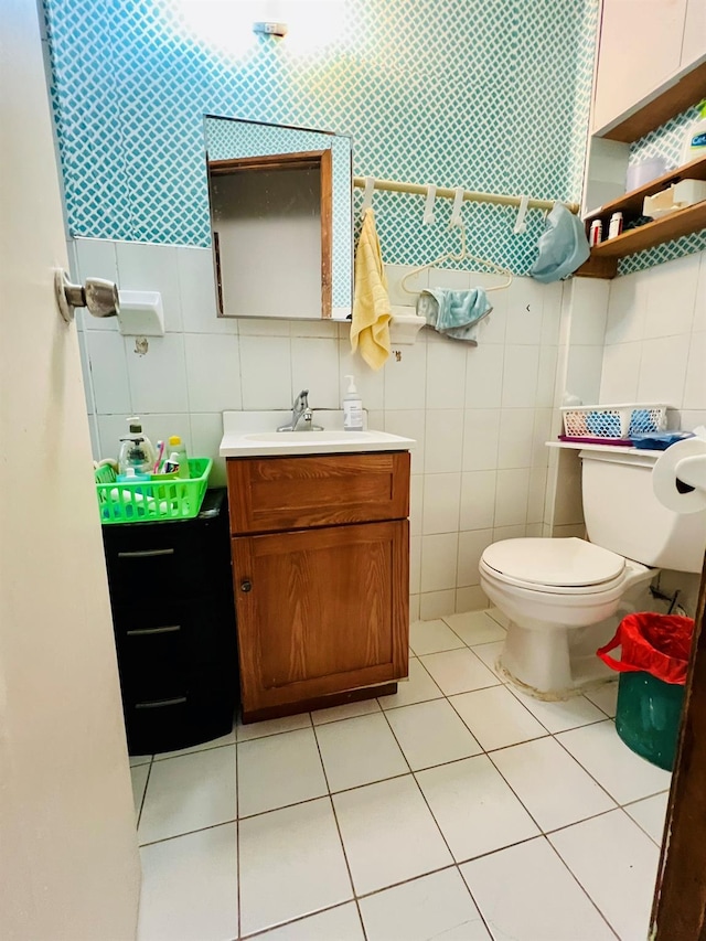 112-21 15th Ave, College Point, NY 11356 - half bathroom with tile walls, tile patterned floors, toilet, and vanity