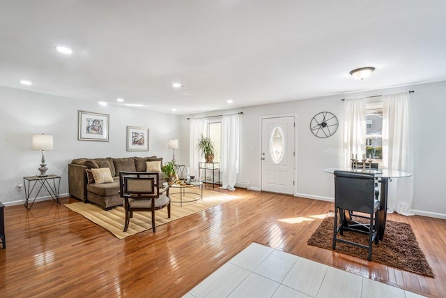 foyer featuring recessed lighting, baseboards, and hardwood / wood-style flooring