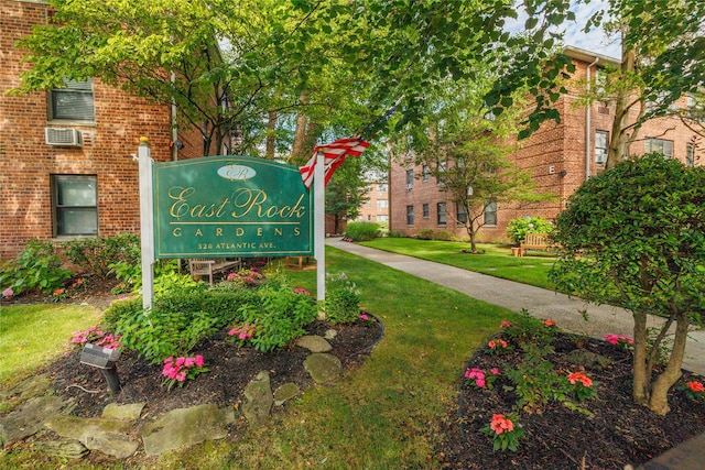 community / neighborhood sign with a lawn