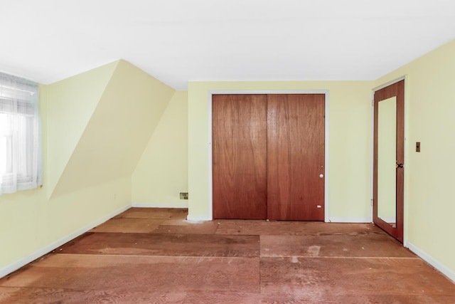 additional living space featuring baseboards