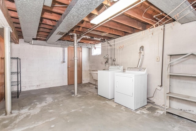 below grade area featuring washer and clothes dryer