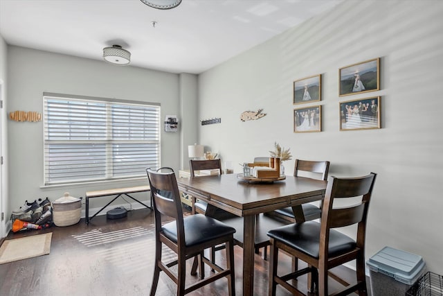 dining space featuring wood finished floors