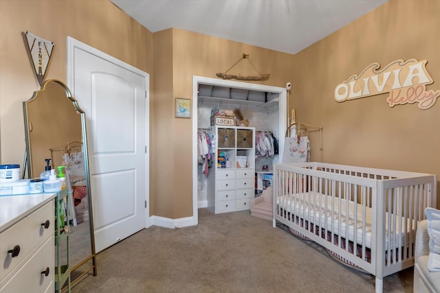 bedroom featuring baseboards, a nursery area, and carpet floors