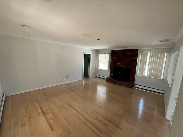 unfurnished living room featuring a baseboard radiator, light wood-type flooring, a baseboard heating unit, and ornamental molding