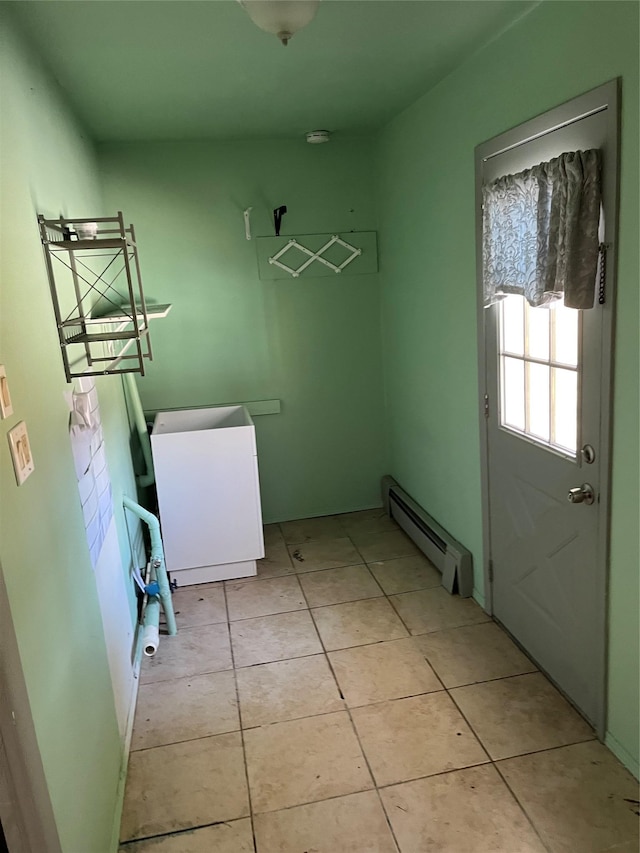 washroom featuring light tile patterned floors and a baseboard heating unit