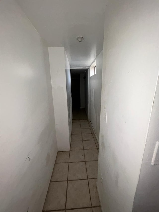 corridor with light tile patterned floors