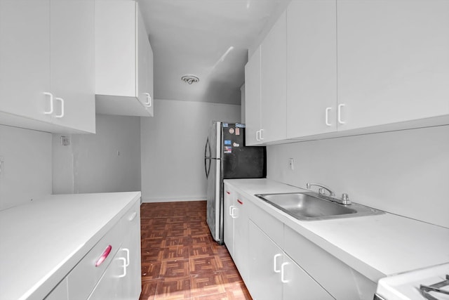 3636 Greystone Ave Unit 6M, Bronx, NY 10463 - kitchen featuring white cabinetry, light countertops, freestanding refrigerator, modern cabinets, and a sink