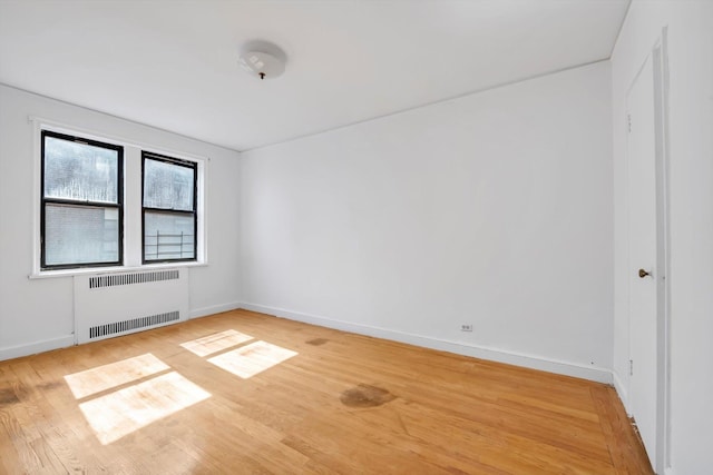 3636 Greystone Ave Unit 6M, Bronx, NY 10463 - spare room featuring light wood-style flooring, radiator heating unit, and baseboards