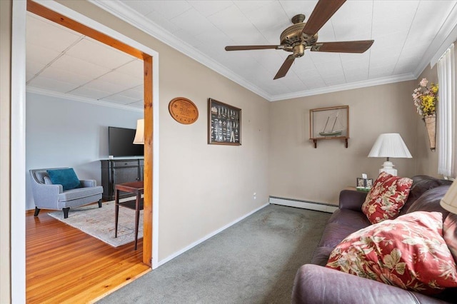 living area with carpet, baseboards, ornamental molding, ceiling fan, and baseboard heating