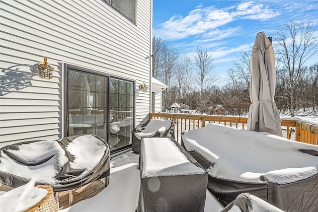 snow covered deck featuring outdoor lounge area