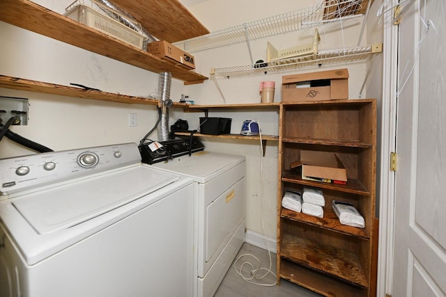 laundry area with washing machine and dryer and laundry area