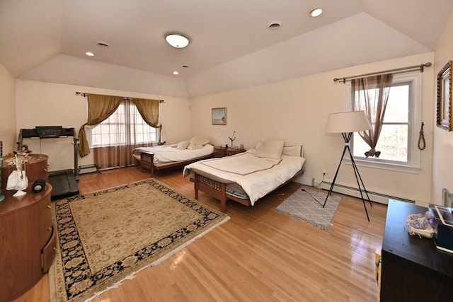 bedroom featuring a baseboard radiator, lofted ceiling, wood finished floors, and recessed lighting