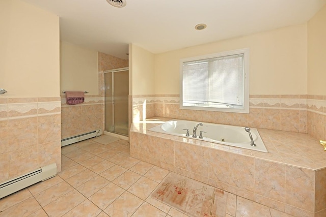 full bath with a shower stall, a baseboard heating unit, a bath, and tile patterned flooring
