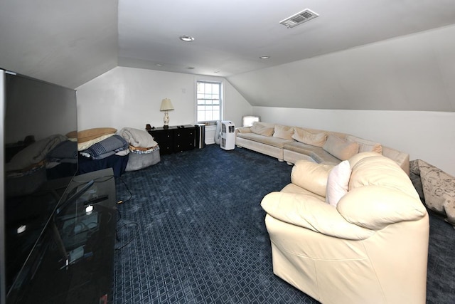 carpeted living room with lofted ceiling and visible vents