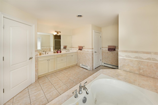 bathroom featuring a jetted tub, baseboard heating, visible vents, and a sink