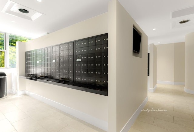 interior space featuring tile patterned flooring, mail area, recessed lighting, and baseboards