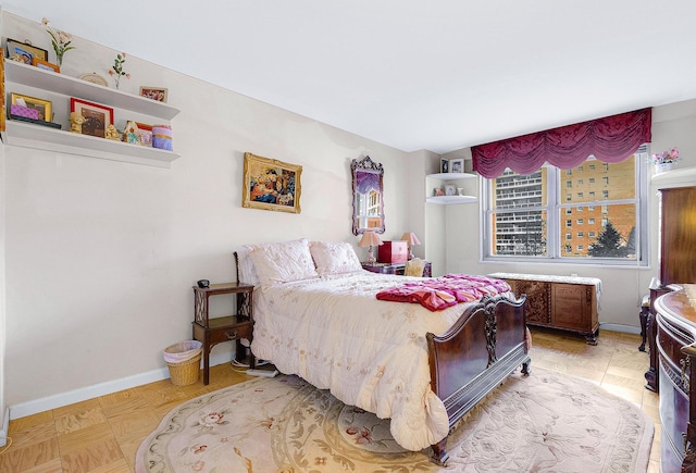 bedroom featuring baseboards