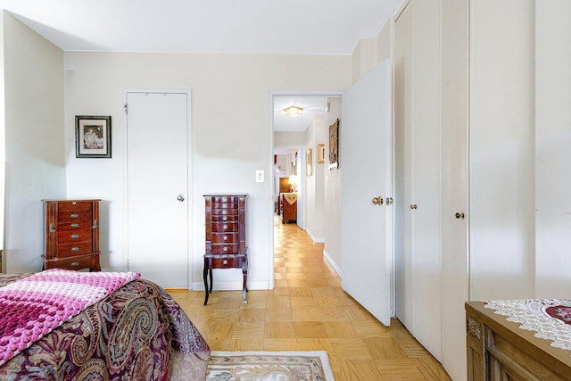 bedroom featuring a closet and baseboards