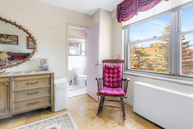 sitting room featuring radiator