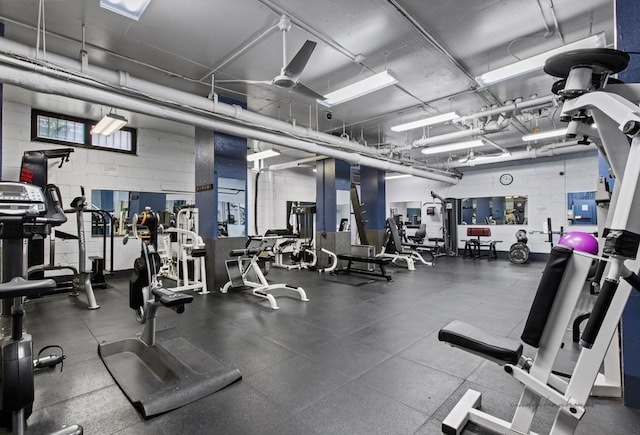 workout area featuring concrete block wall