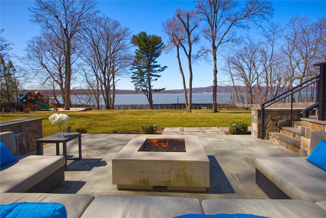 30 Half Moon Ln, Irvington, NY 10533 - view of patio / terrace featuring stairs, an outdoor living space with a fire pit, a playground, and a water and mountain view
