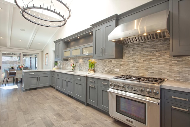 30 Half Moon Ln, Irvington, NY 10533 - kitchen with extractor fan, light countertops, high end stove, a sink, and gray cabinetry