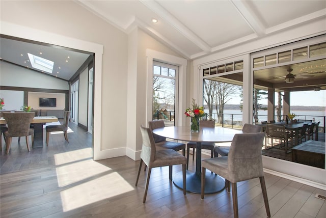 30 Half Moon Ln, Irvington, NY 10533 - dining space with a wealth of natural light, vaulted ceiling with skylight, and wood finished floors