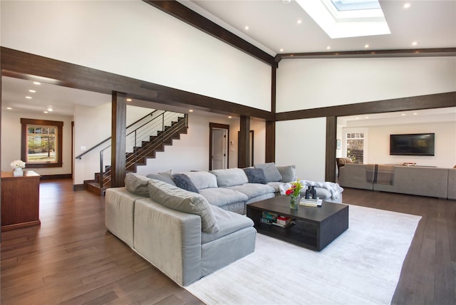 30 Half Moon Ln, Irvington, NY 10533 - living area featuring stairs, recessed lighting, wood finished floors, a towering ceiling, and a skylight