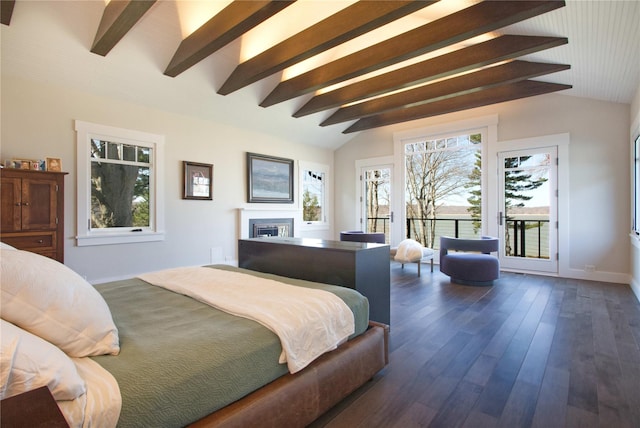 30 Half Moon Ln, Irvington, NY 10533 - bedroom featuring a fireplace, baseboards, access to outside, lofted ceiling with beams, and dark wood finished floors