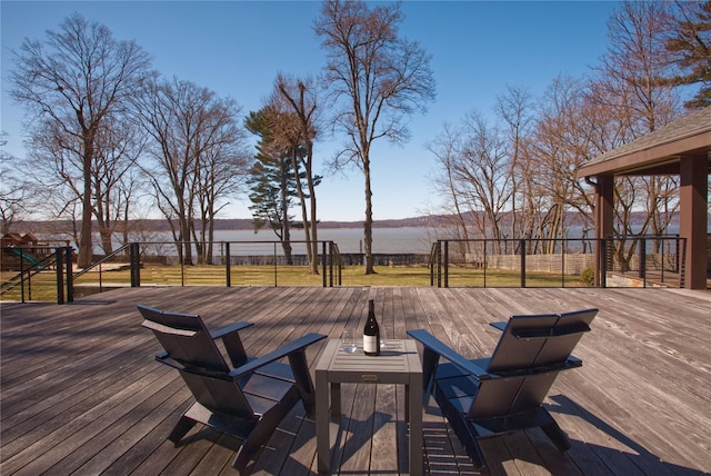 30 Half Moon Ln, Irvington, NY 10533 - wooden deck with outdoor dining space and a water view