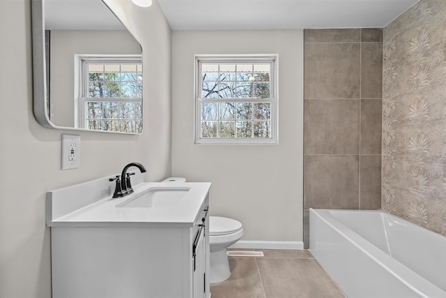 bathroom featuring vanity, tile patterned floors, toilet, and baseboards