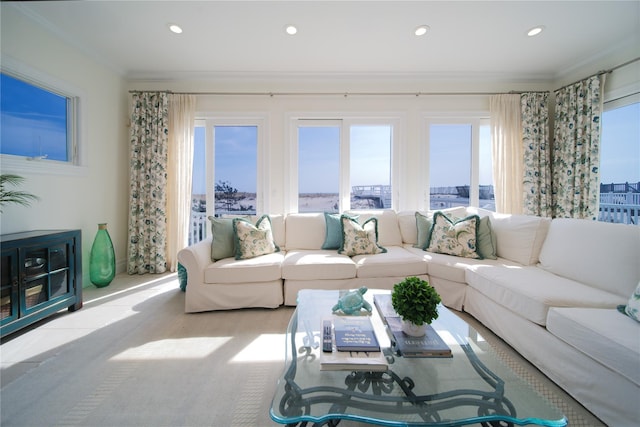 living area featuring recessed lighting and crown molding